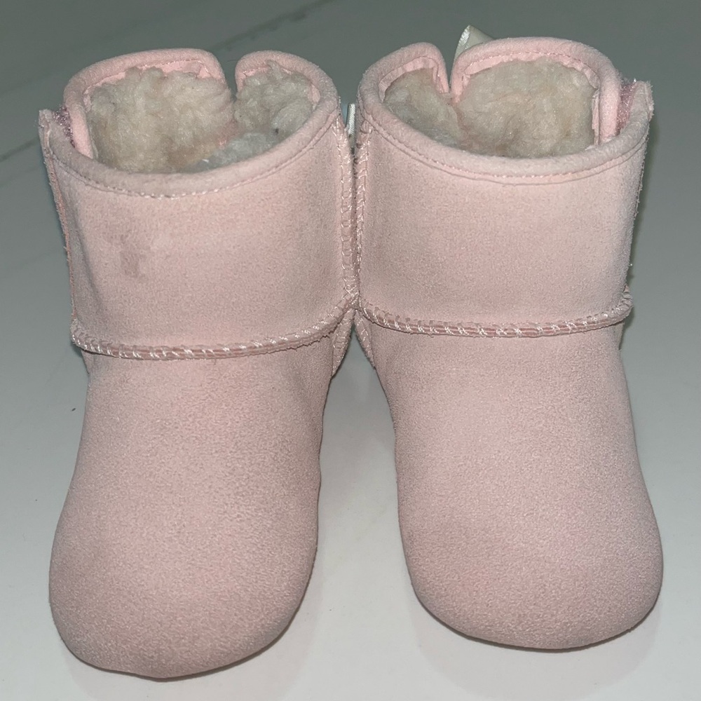 UGG Baby size 04/05. Worn once. Pastel pink with back bows. Velcro closure.